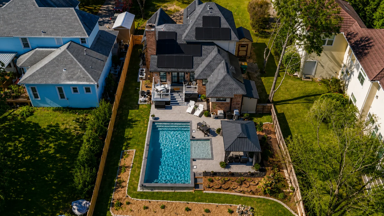 Aerial view of a custom backyard pool built by Neway Pools