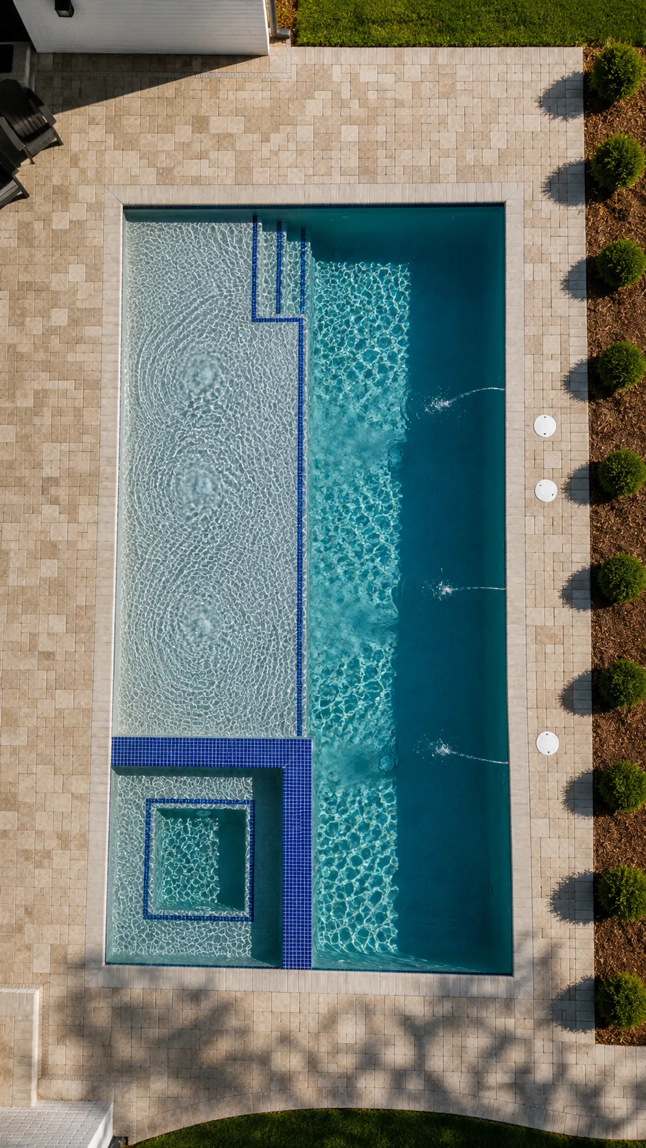 Aerial view of a custom backyard pool built by Neway Pools