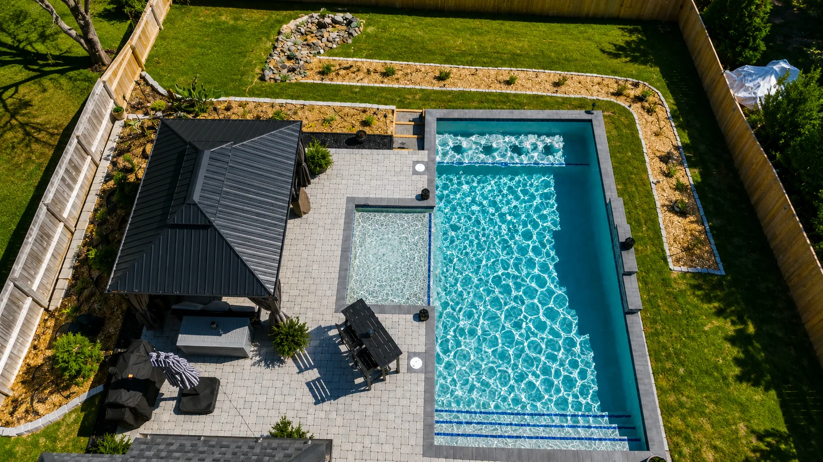 Aerial view of a custom backyard pool built by Neway Pools