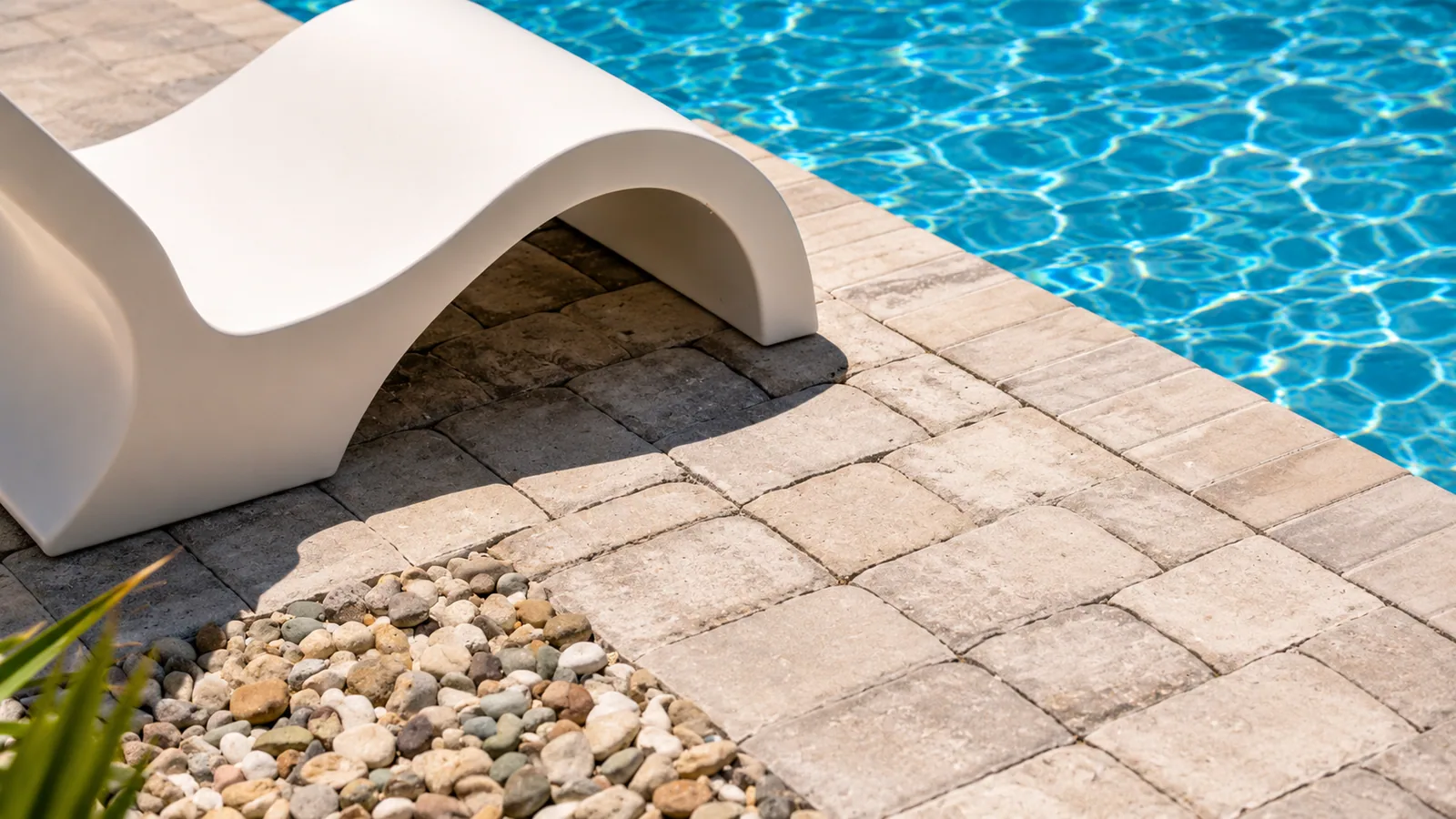 Poolside lounge area beside a custom Neway pool Poolside lounge area beside a custom Neway pool