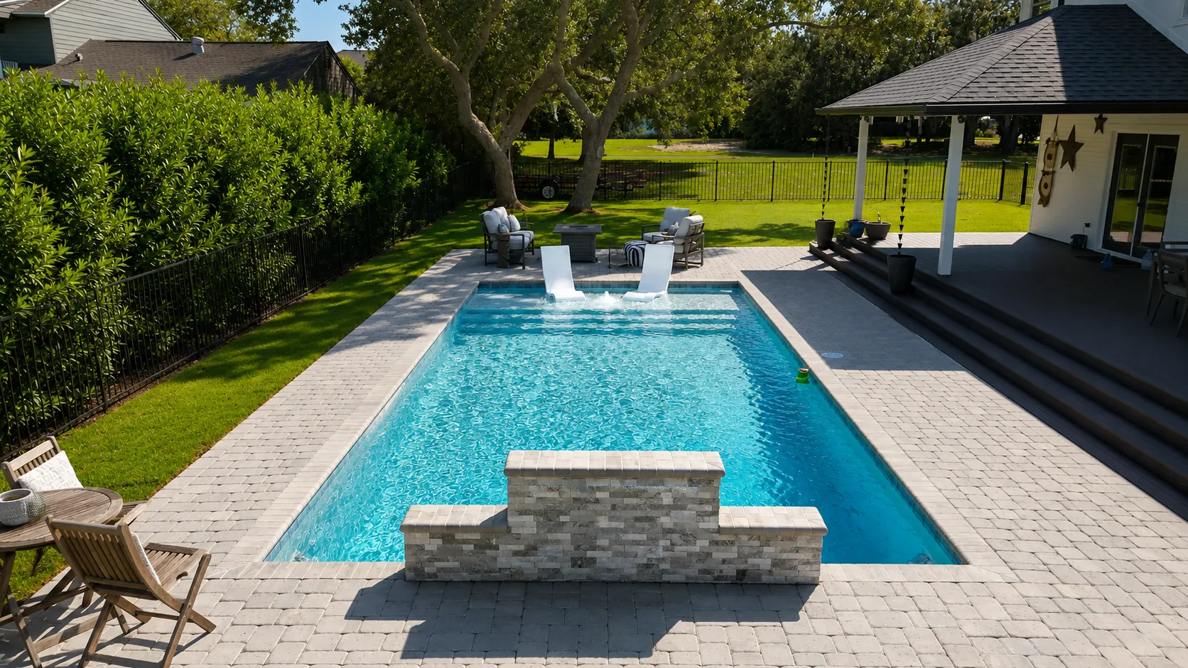Aerial view of a custom backyard pool built by Neway Pools Aerial view of a custom backyard pool built by Neway Pools