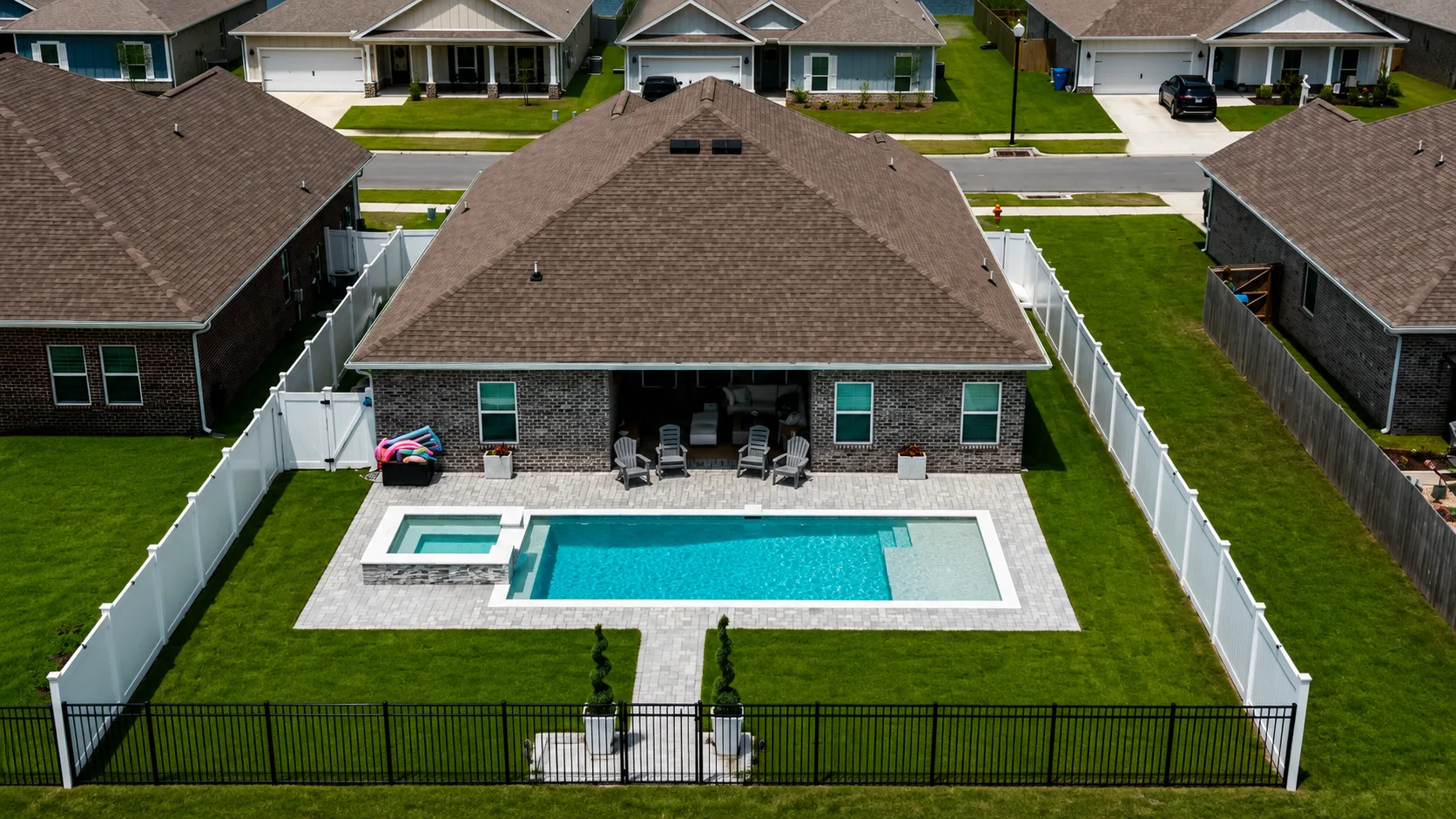 Aerial view of a custom backyard pool built by Neway Pools
