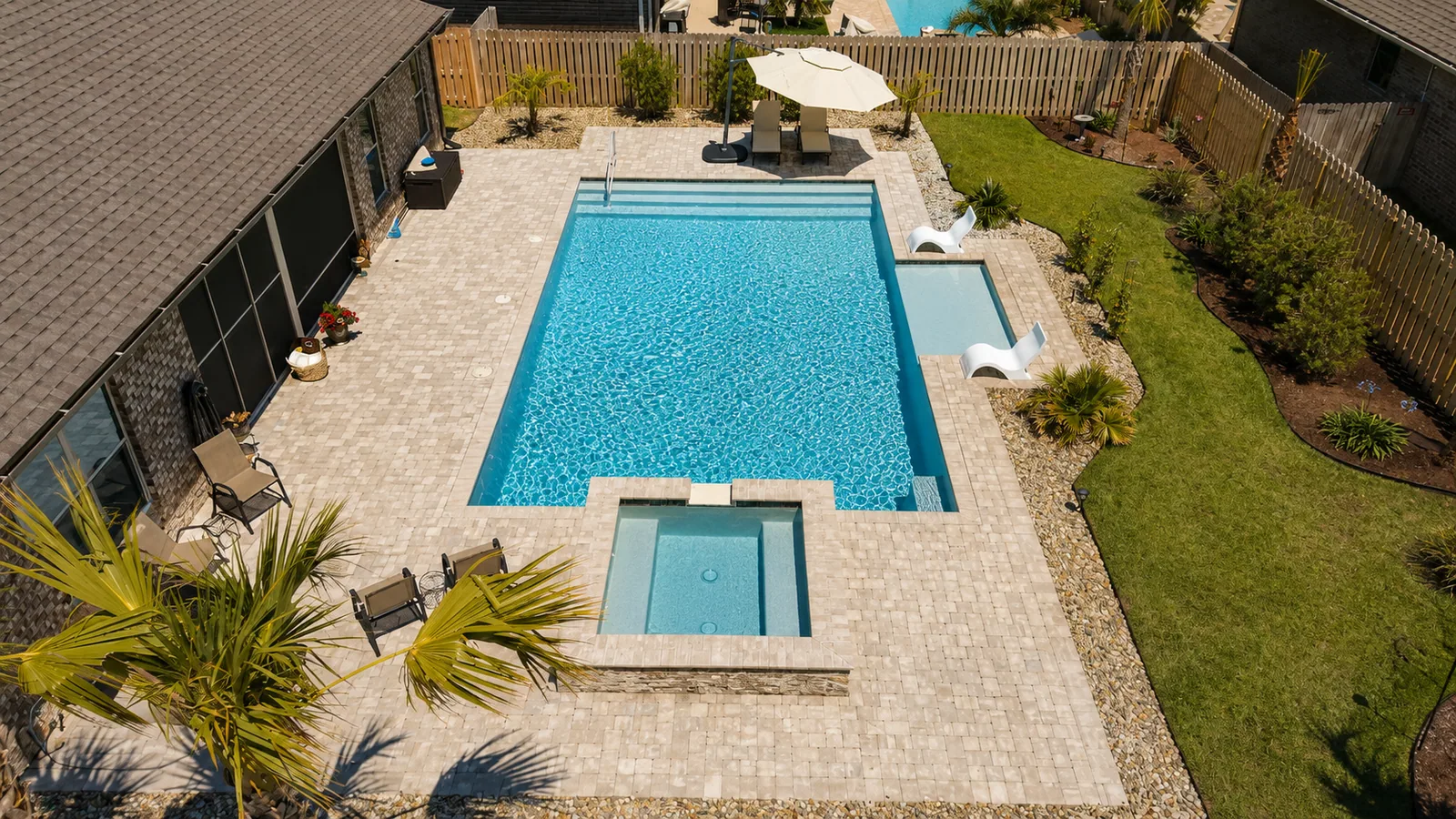 Aerial view of a custom backyard pool built by Neway Pools