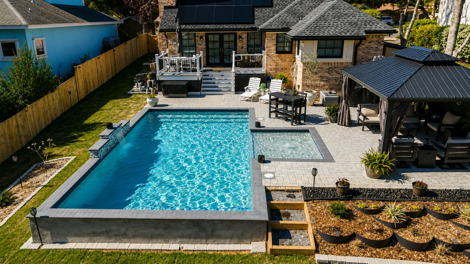 Aerial view of a custom backyard pool built by Neway Pools