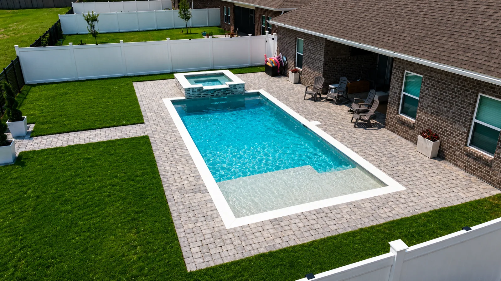 Aerial view of a custom backyard pool built by Neway Pools