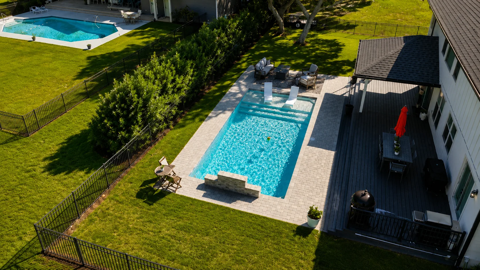 Fire feature beside a completed Neway Pools swimming pool