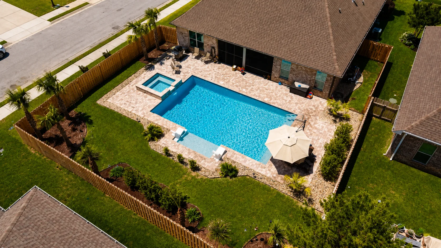 Aerial view of a custom backyard pool built by Neway Pools
