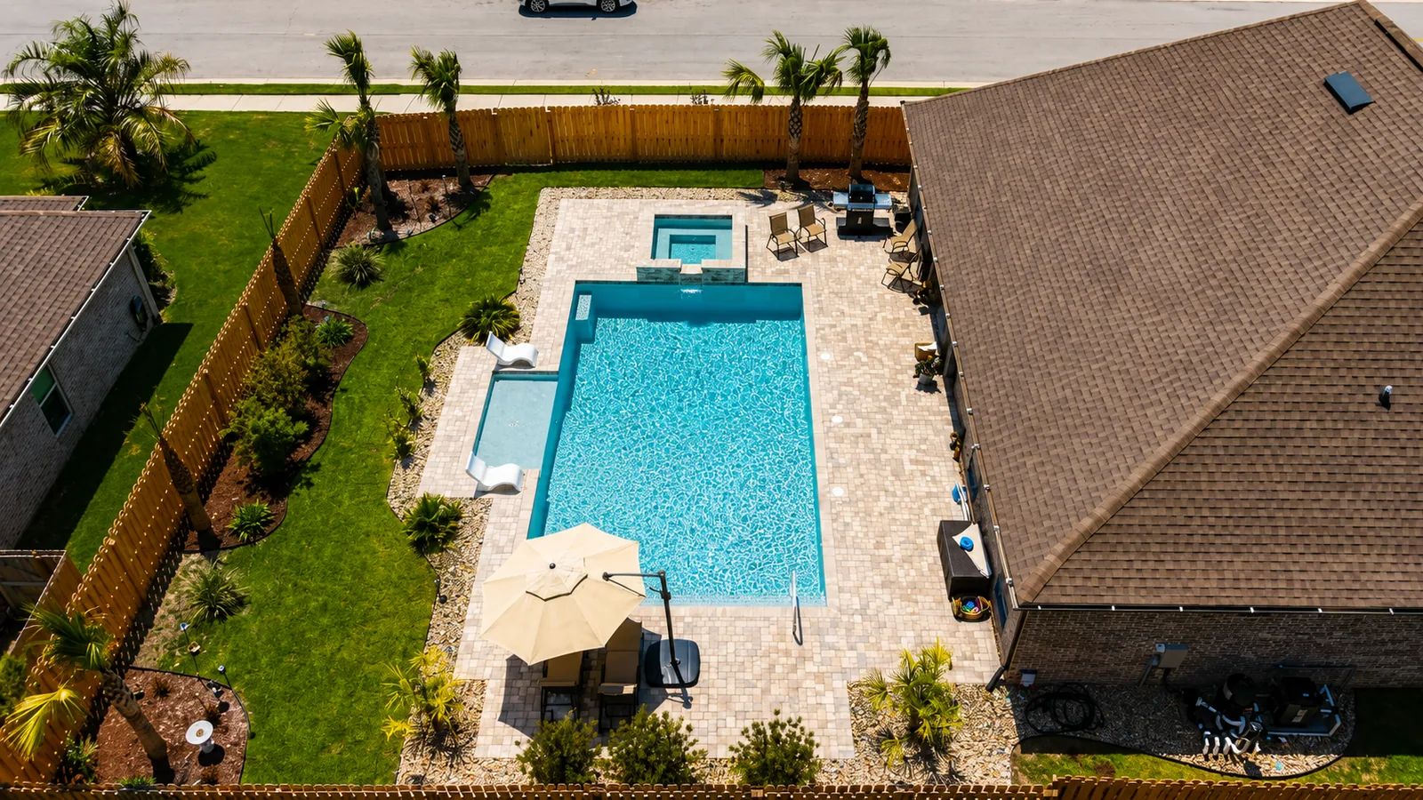 Aerial view of a custom backyard pool built by Neway Pools Aerial view of a custom backyard pool built by Neway Pools
