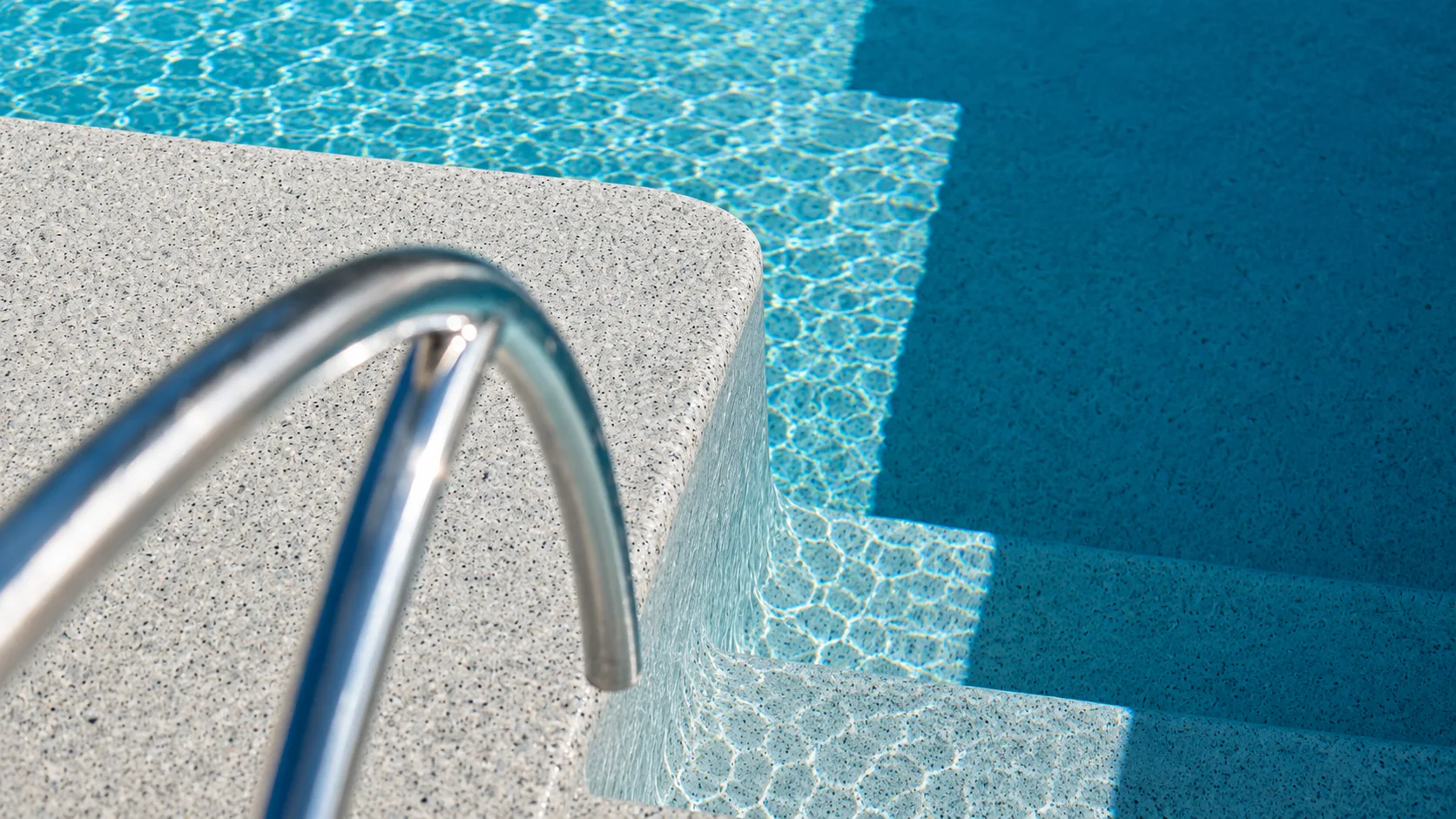 Pool entry steps and tanning ledge on a Neway Pools project