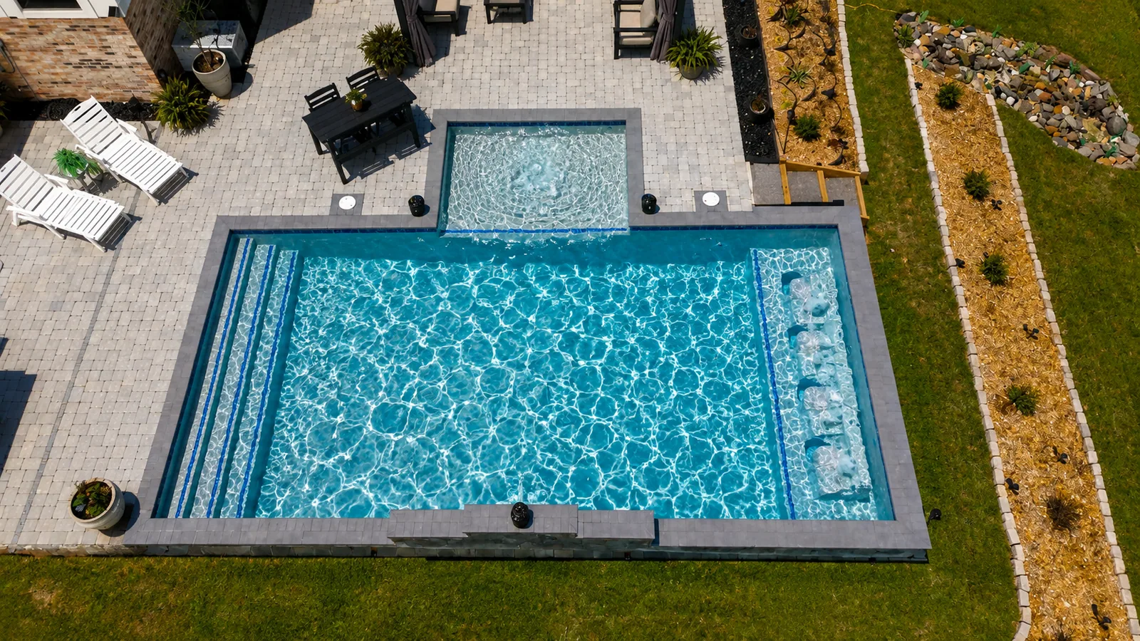 Aerial view of a custom backyard pool built by Neway Pools