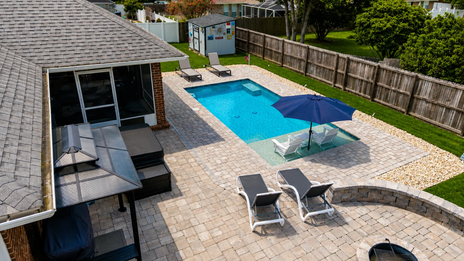 Aerial view of a custom backyard pool built by Neway Pools