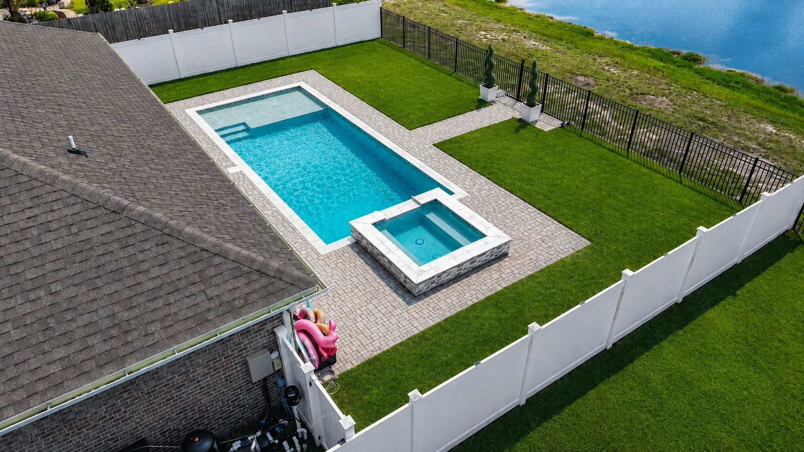 Aerial view of a custom backyard pool built by Neway Pools