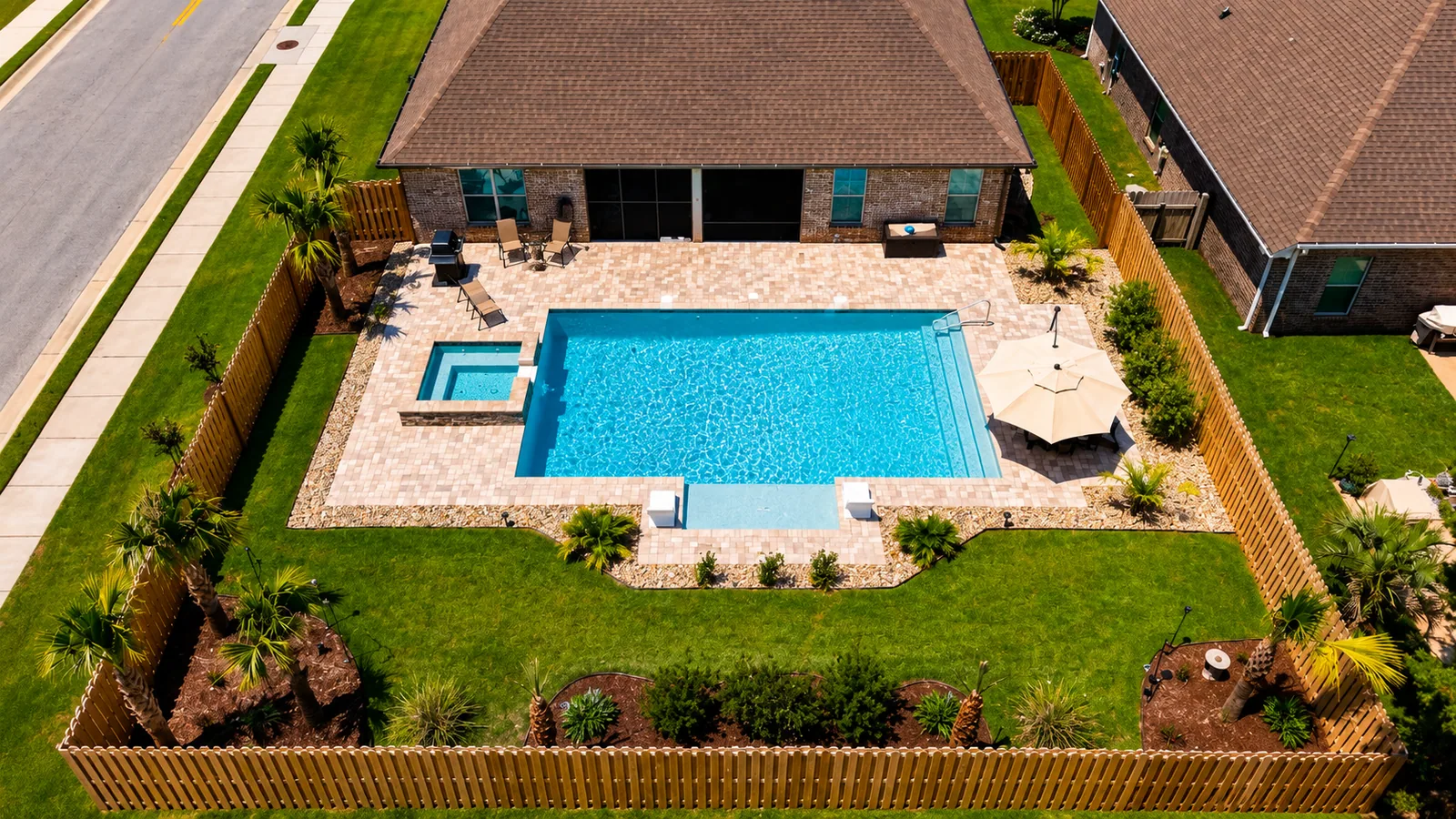 Aerial view of a custom backyard pool built by Neway Pools