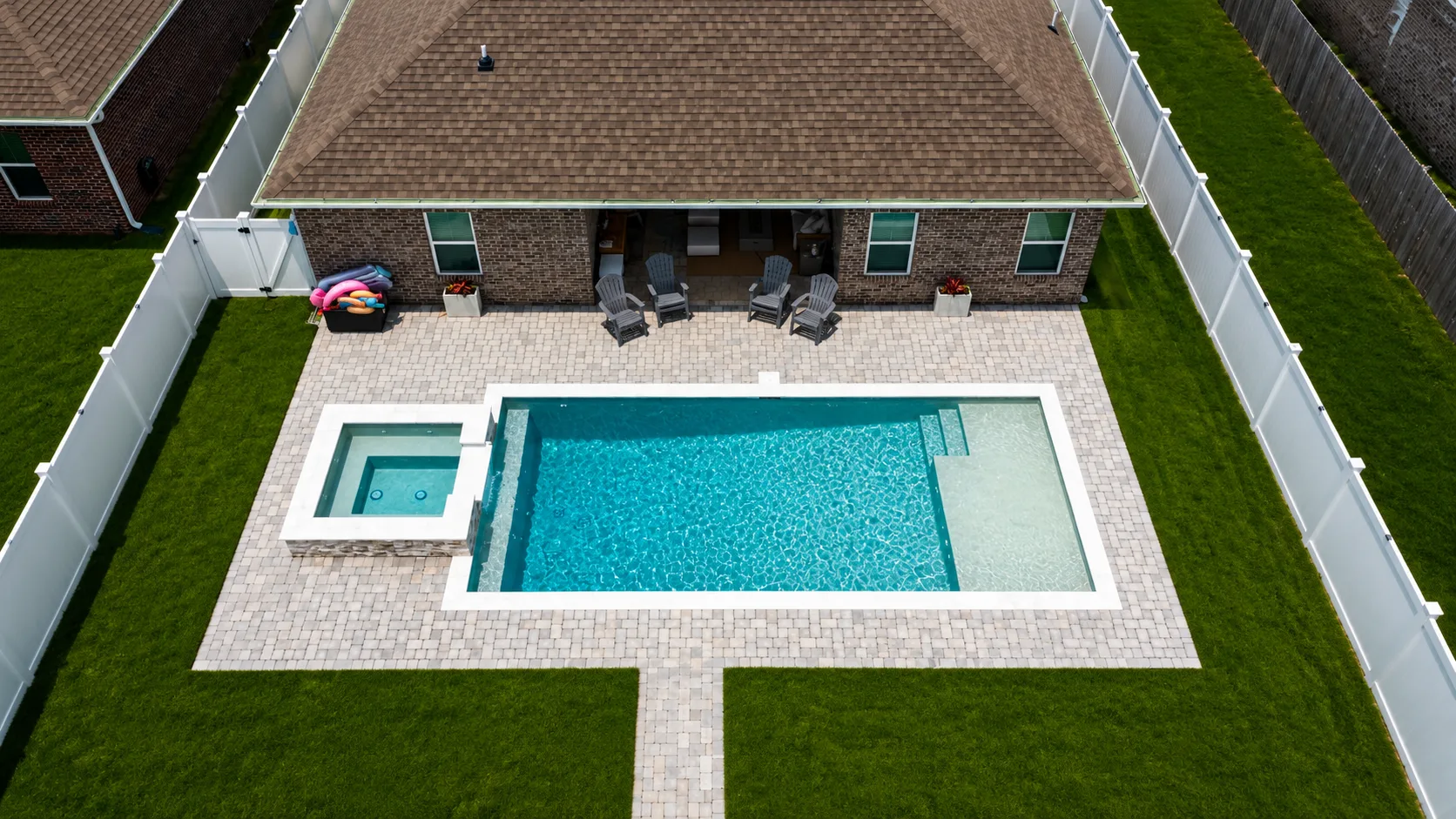 Aerial view of a custom backyard pool built by Neway Pools