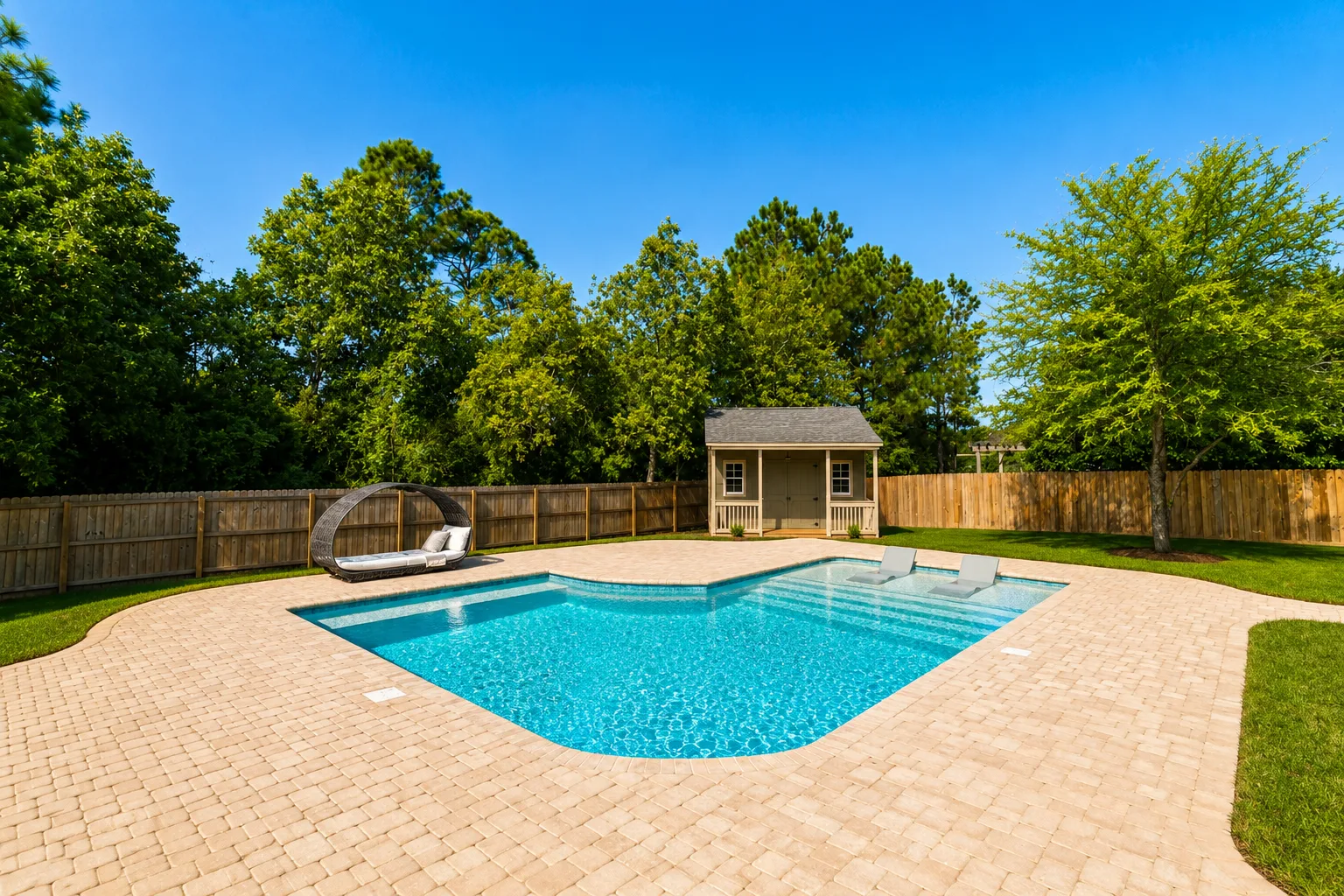 Poolside living space beside a custom Neway Pools pool