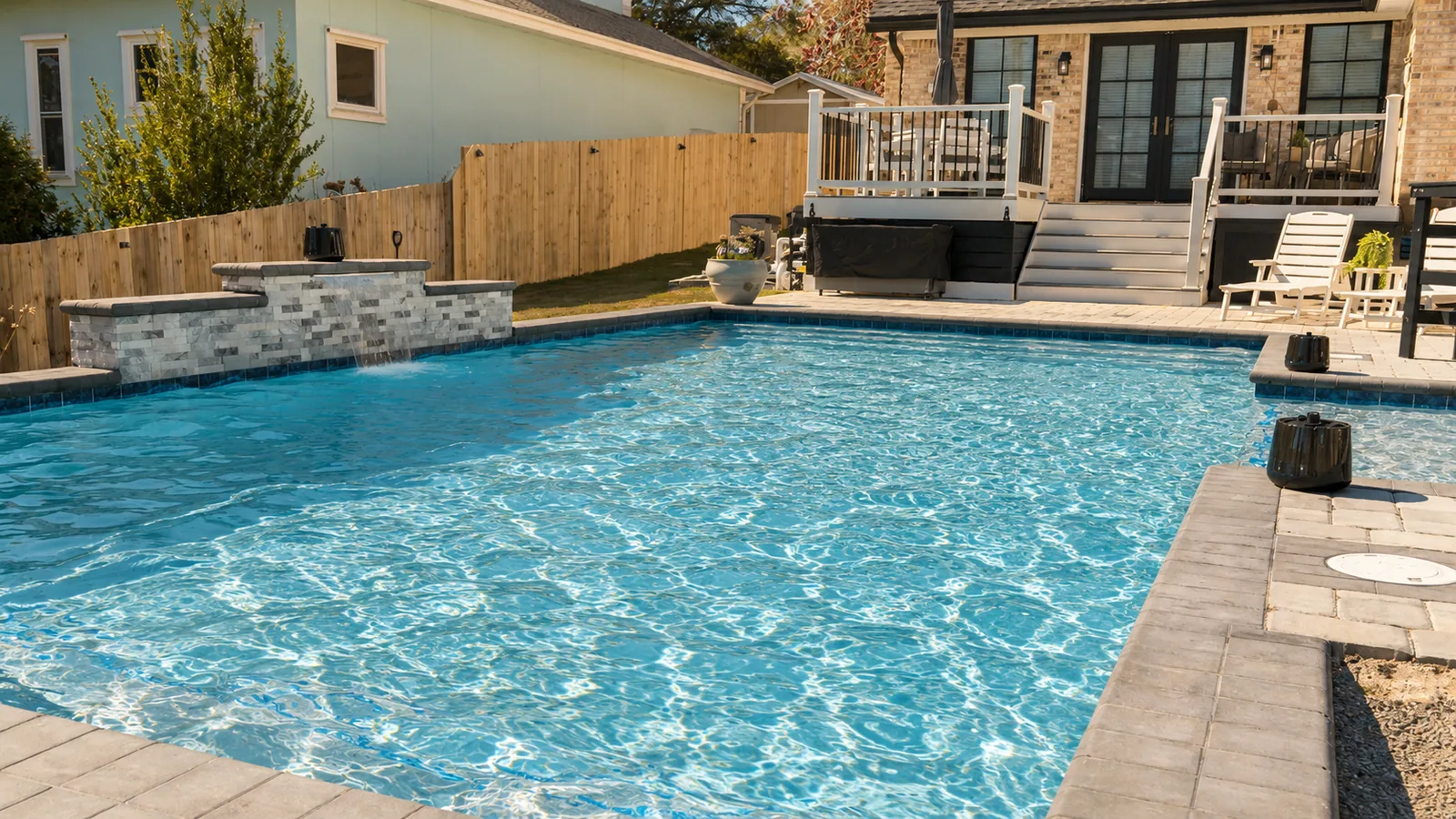 Custom rectangular swimming pool with paver decking