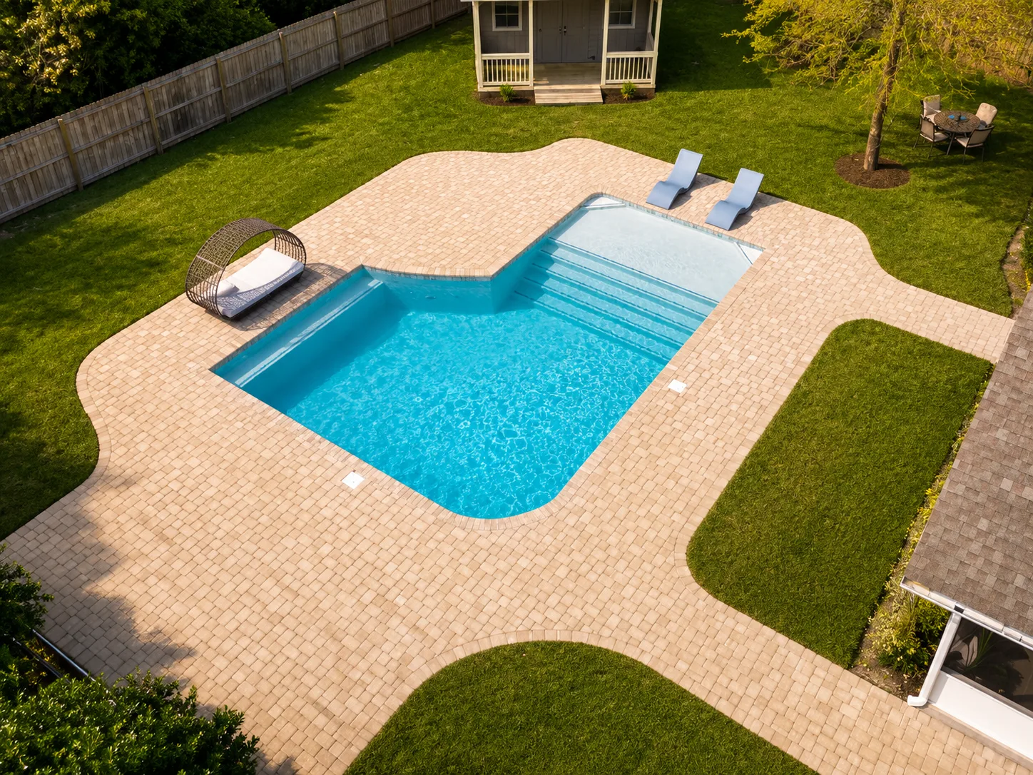 Aerial view of a custom backyard pool built by Neway Pools Aerial view of a custom backyard pool built by Neway Pools