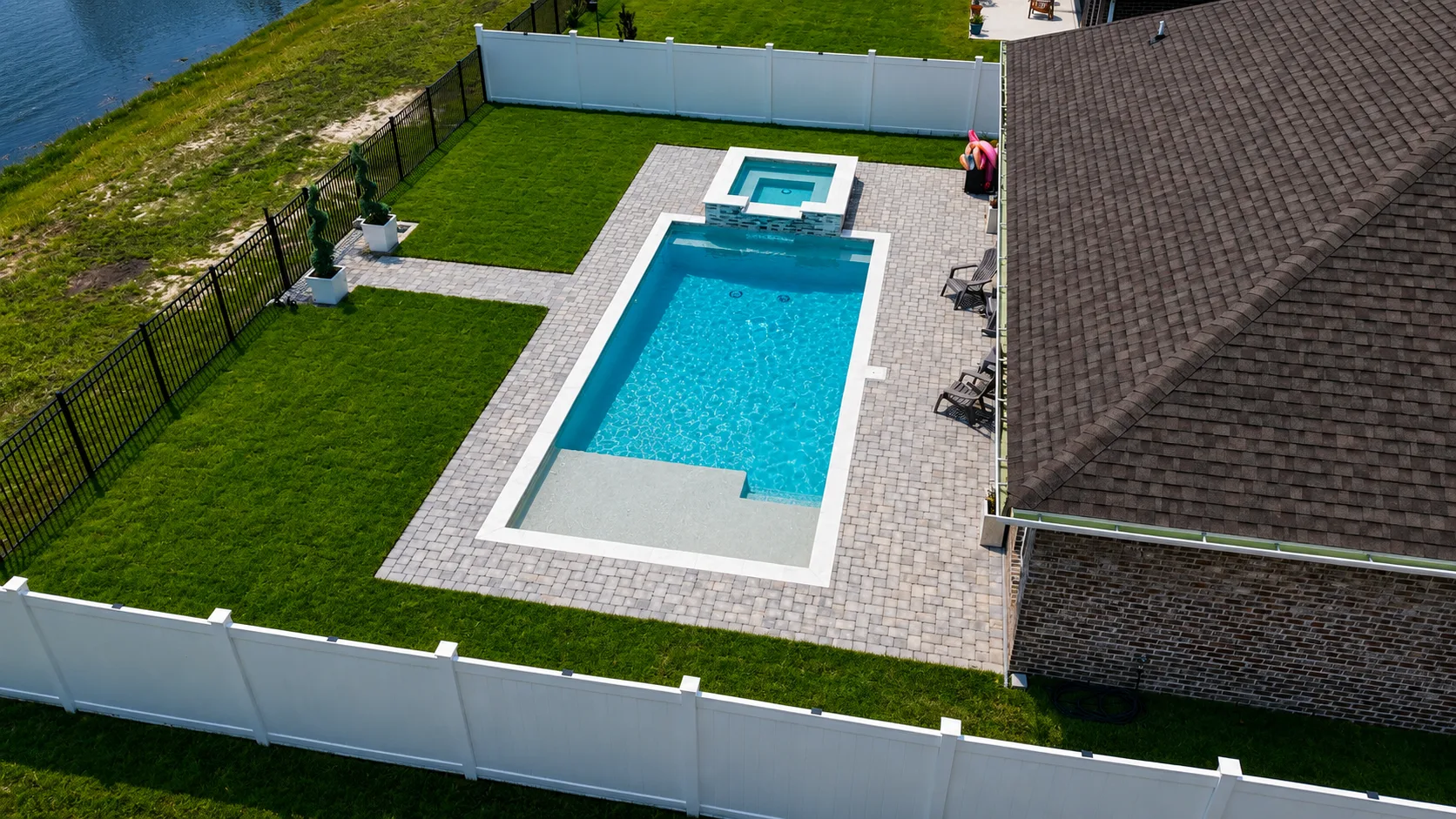 Aerial view of a custom backyard pool built by Neway Pools