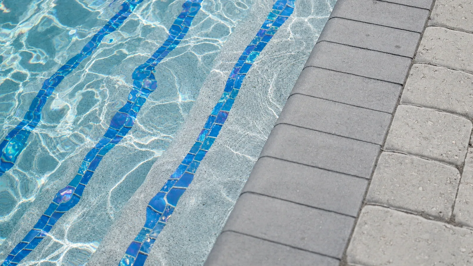 Waterline tile and coping detail on a custom Neway pool Waterline tile and coping detail on a custom Neway pool