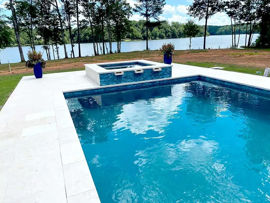 lake with pool and spa, by Peachtree Corners pool builder Neway Pools