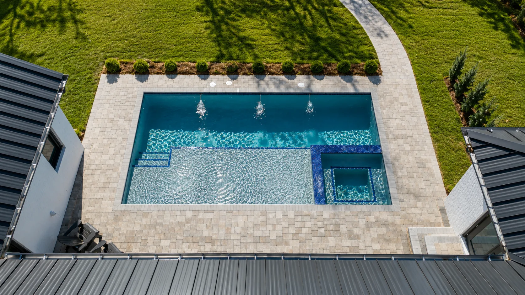 Aerial view of a custom backyard pool built by Neway Pools