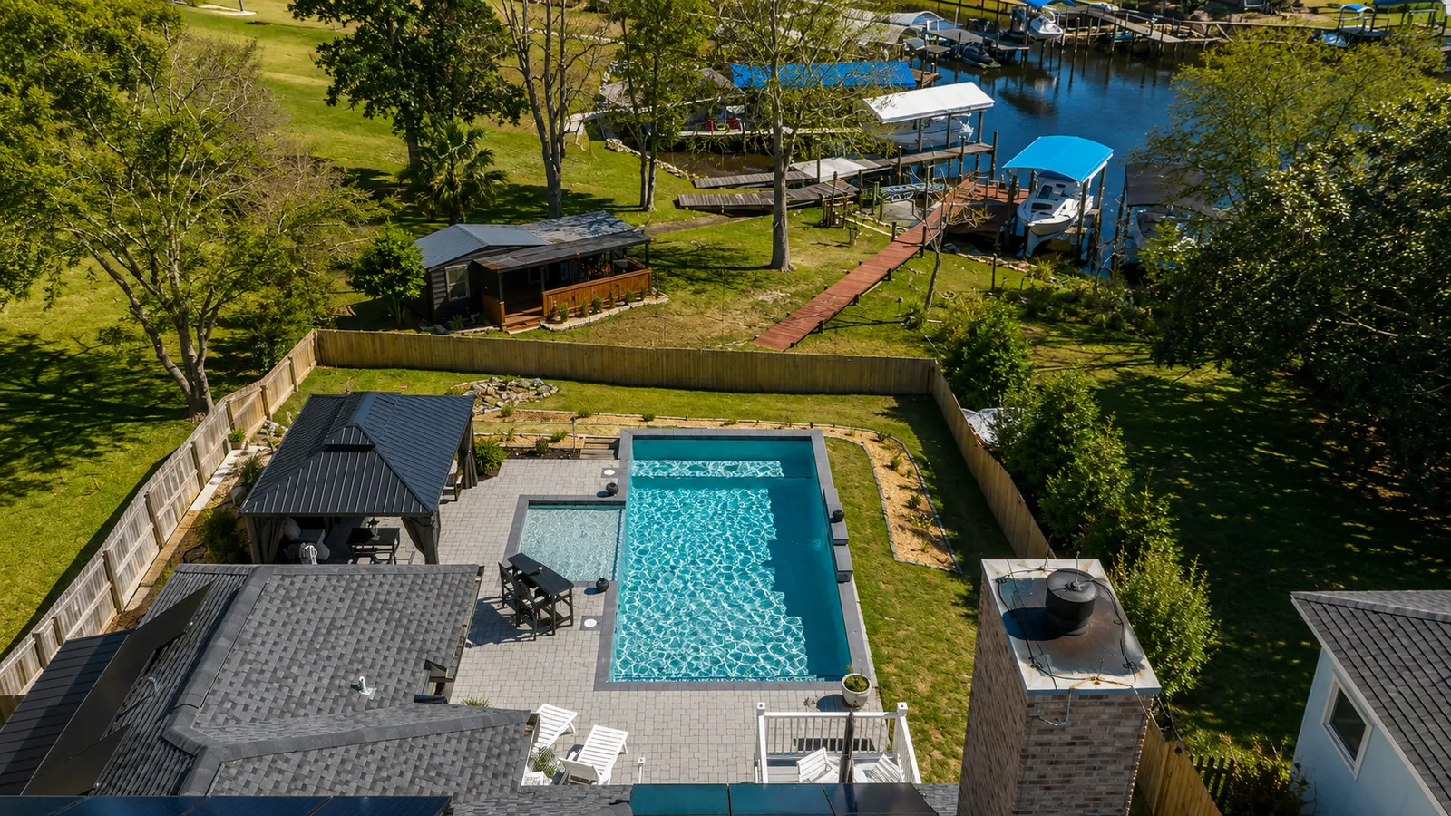 Aerial view of a custom backyard pool built by Neway Pools Aerial view of a custom backyard pool built by Neway Pools