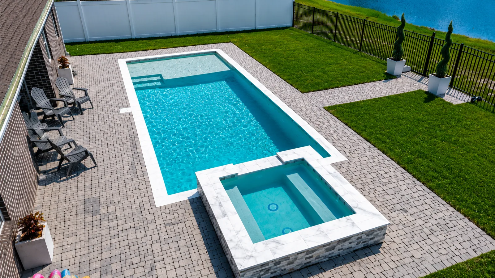 Aerial view of a custom backyard pool built by Neway Pools