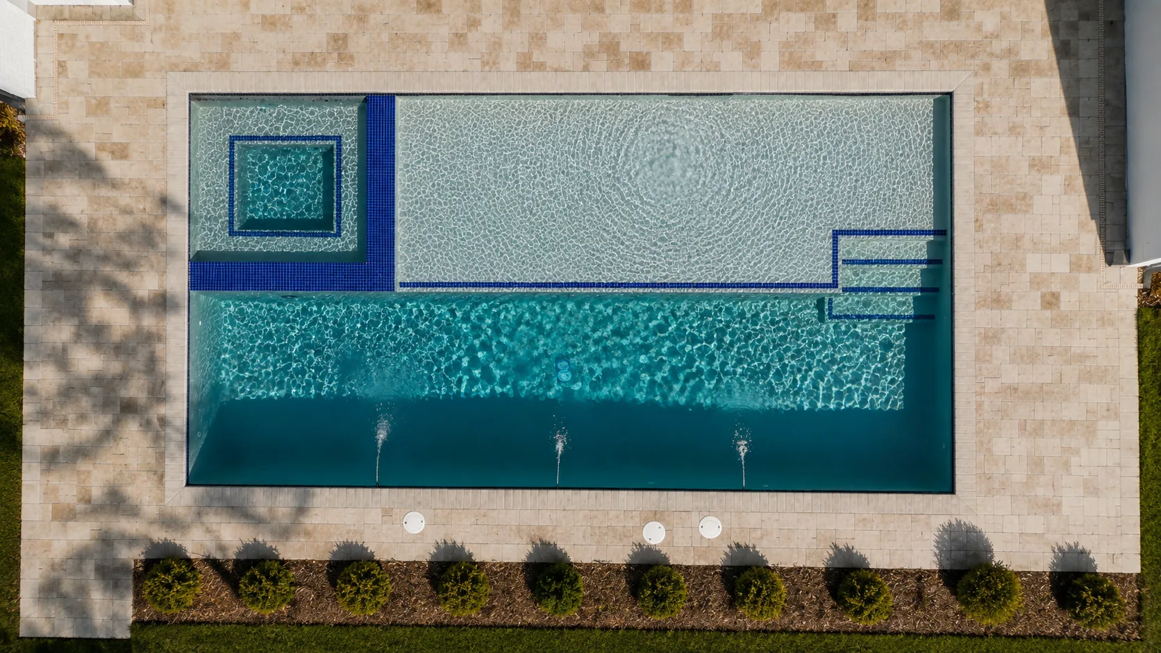 Aerial view of a custom backyard pool built by Neway Pools