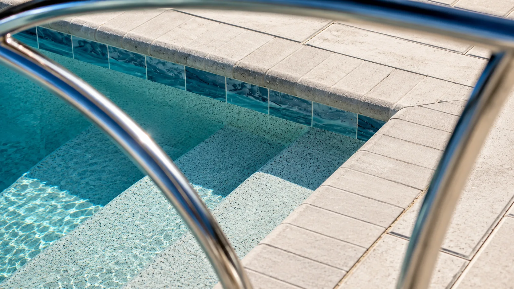 Waterline tile and coping detail on a custom Neway pool