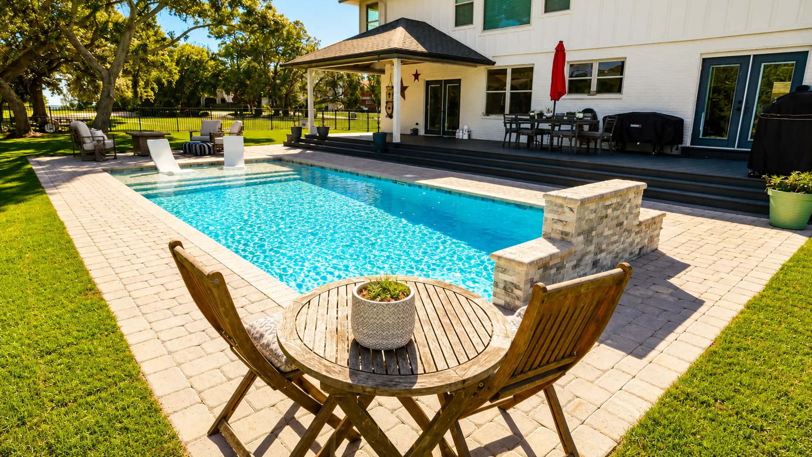 Pool coping and paver decking on a custom Neway pool