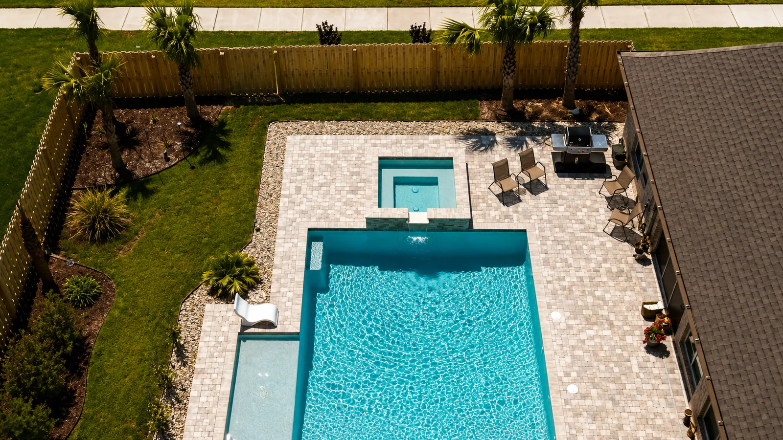 Aerial view of a custom backyard pool built by Neway Pools Aerial view of a custom backyard pool built by Neway Pools