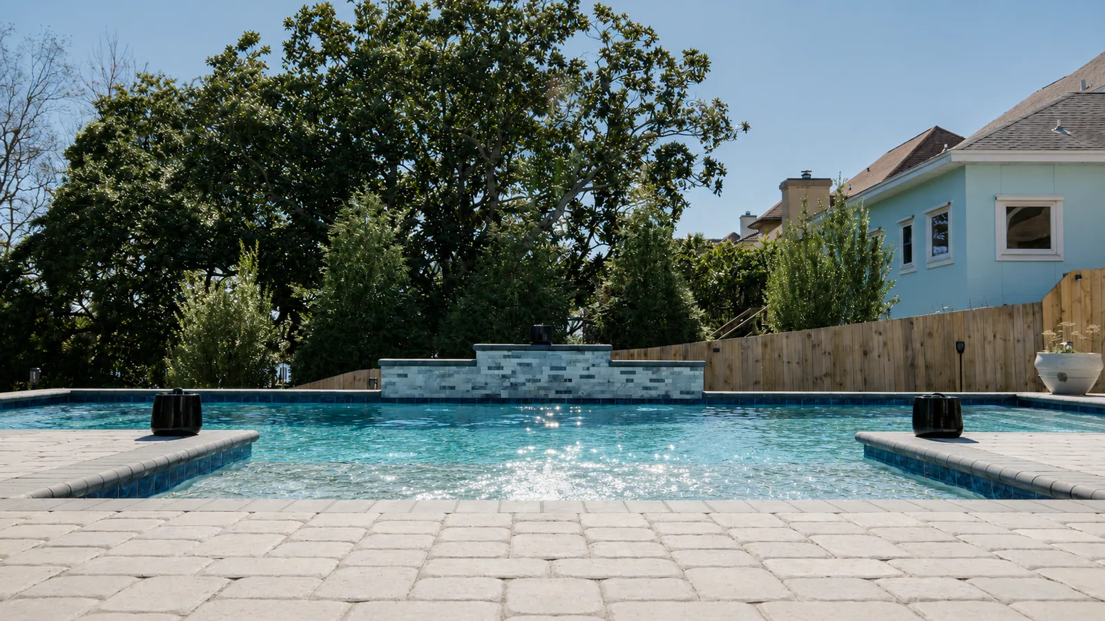 Custom rectangular swimming pool with paver decking