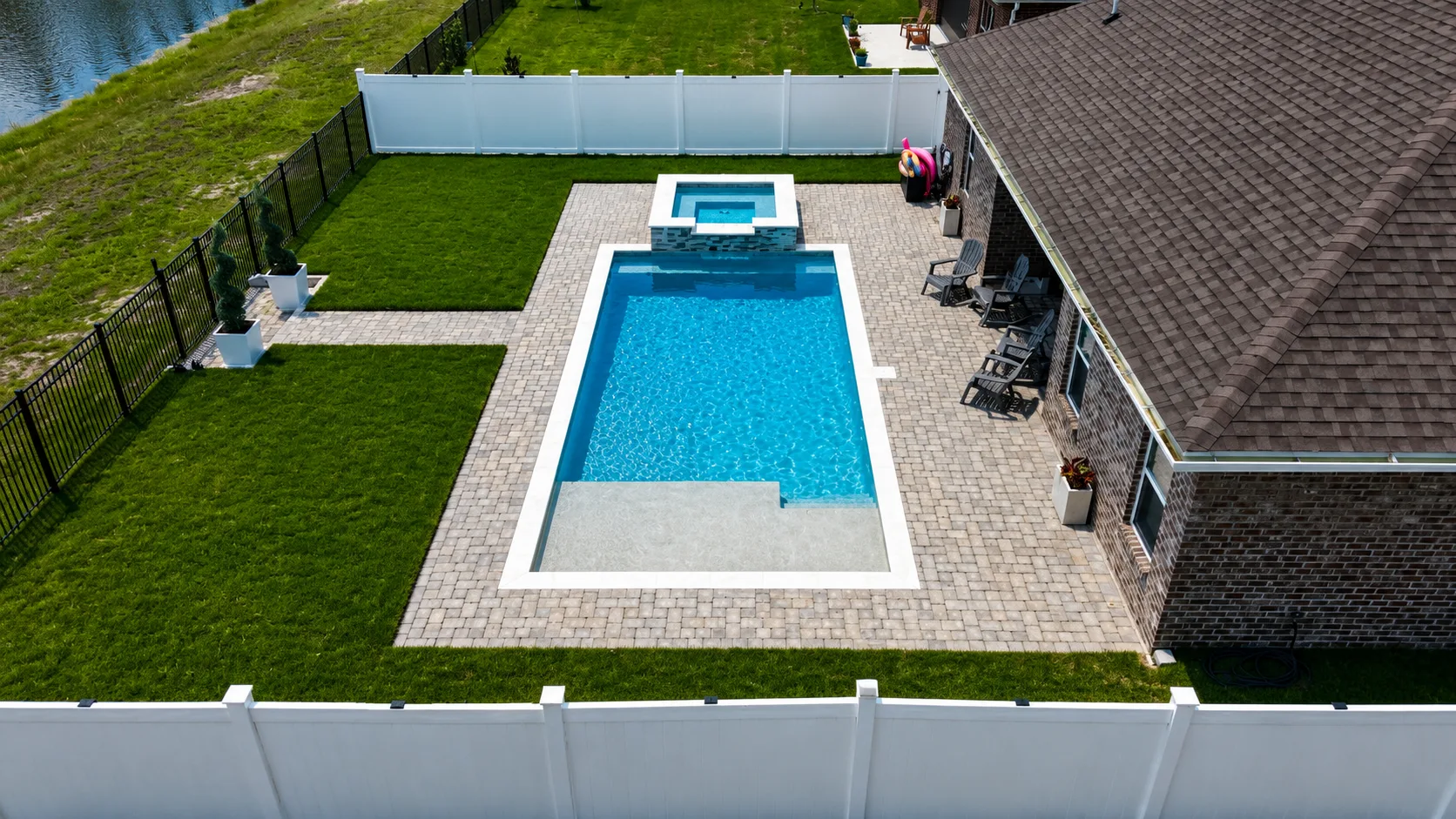 Aerial view of a custom backyard pool built by Neway Pools